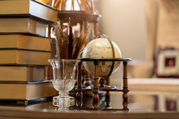 decorating items on wooden working table study room home interior concept