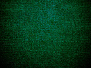dark green textured background. with dark edges. for lettering and copy space
