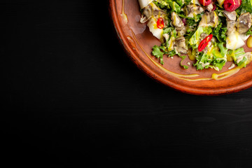 Raspberry, pineapple, lettuce and champignon salad with sauce.