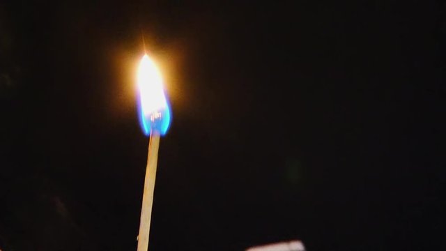 match ignition on a dark background