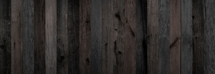 Texture of old wooden boards for background. Dark grunge parquet flooring made from barn boards.