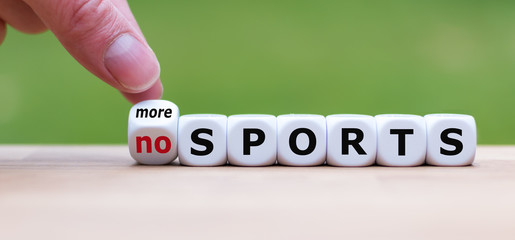 Hand turns a dice and changes the expression "no sports" to "more sports".