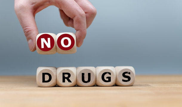Cubes form the expression "no drugs". The letters "NO" where lifted by a hand.