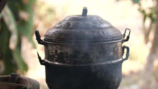 Black pot on fire bunner