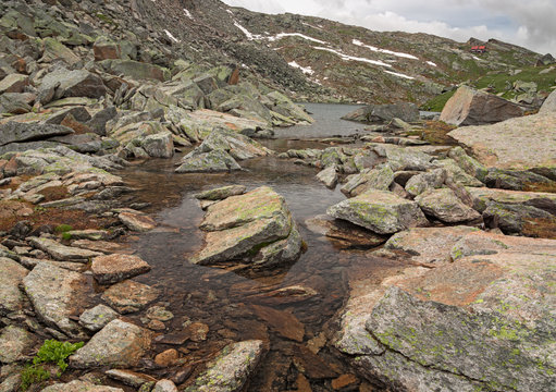 Alpine ponds in view of the Rifugio Citt&agrave; di Chivasso at Col del Nivolet, in the Gran Paradiso park, Italy.