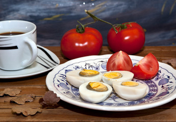 boiled egg with tomato and black coffee