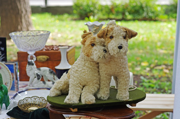 Vintage toys of foxterriers at a flea market