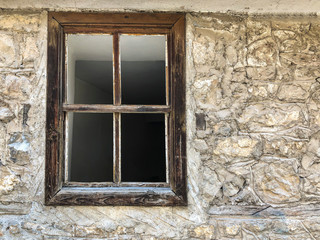 Fototapeta na wymiar wooden window of an abandoned brick house