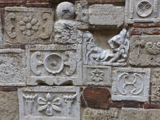 Montepulciano town. Wall with different stones reused