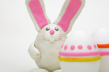 Plasticine rabbit with easter eggs.