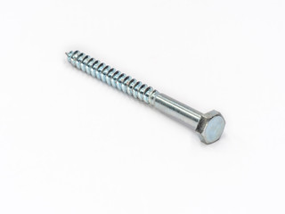 Zinc plated steel hexagonal head lag screw shot on white.