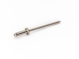 Stainless steel flat pop rivet with stainless steel mandrel on white.