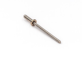 Stainless steel flat pop rivet with stainless steel mandrel on white.