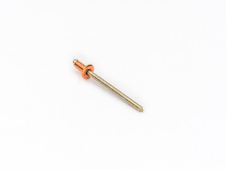 Copper flat pop rivet with zinc plated mandrel on white.