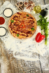 Delicious pizza with chicken ham, mozzarella and barbeque