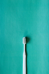 White toothbrush on pink background, pop art, simple and conceptual style photo with space for your design