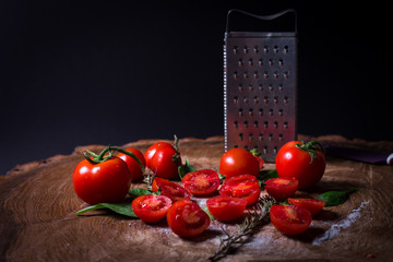 Red fresh tomatoes, grater, salt, bay leaf and parsley.