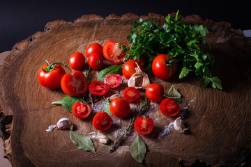 Red fresh tomatoes, grater, salt, bay leaf and parsley.