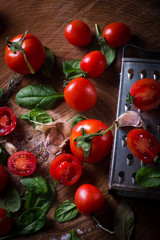 Red fresh tomatoes, grater, salt, bay leaf and parsley.