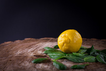 Composition with fresh lemon and spinach. 