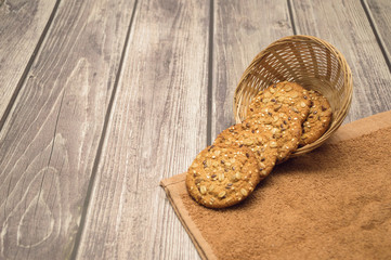 Oatmeal cookies with cereals on a wooden table