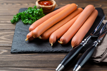 Raw frankfurter sausages