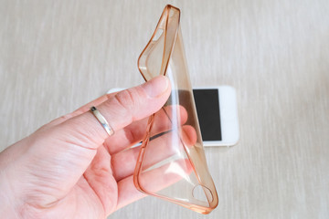 Silicone case for smartphone bent in his hand