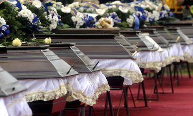 Caskets lined during memorial service before funeral