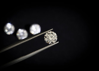 Diamond round shape in tweezers.