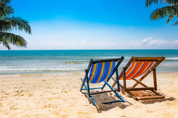 View of the chair on the beach, blue sky Summer vacation concept Consists of travel websites