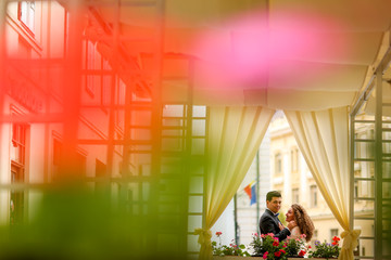 Beautiful wedding couple posing indoor near window