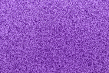 Purple carpet texture. Magenta color abstract wallpaper.