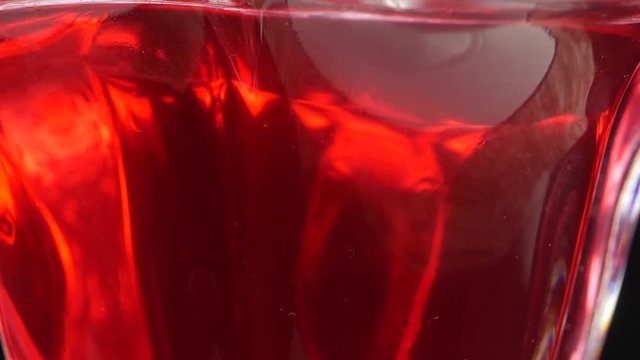 Tasty red jelly in bowl. red substance in a glass bowl