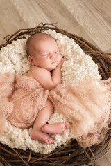 Newborn baby sleeping in a beautiful pose