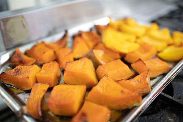 Pumpkin baked on a baking sheet. Healthy vegan food concept. honey pumpkin baked in the oven