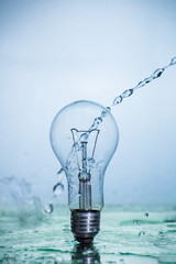 Bulb lamp with motion freezed water splashes.