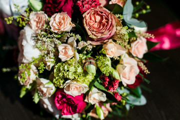 wedding bouquet and wine glasses