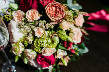 wedding bouquet and wine glasses