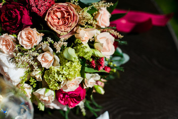 wedding bouquet and wine glasses