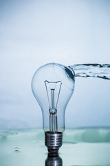 Bulb lamp with motion freezed water splashes.