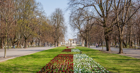 Warsaw, Poland - April 3, 2019: Beautiful Saxon garden, park with red, blue and white flowers.
