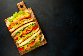 delicious hot dogs on a stone background with copy space for your text