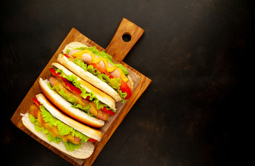 delicious hot dogs on a stone background with copy space for your text