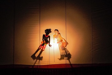 Nang Talung traditional Thai puppet shadow theater playing on stage.