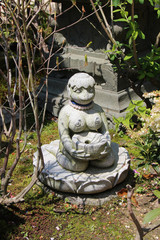 statue of a divinity in a buddhist temple (daisho-in) in miyajima (japan)