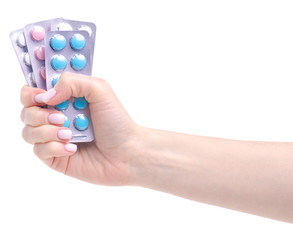 Blister pills in hand on white background isolation. Pharmacy and medicine concept