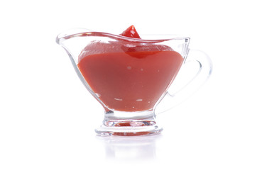 Glass sauceboat tomato on white background isolation