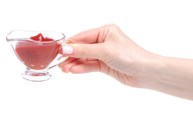 sauceboat tomato in hand on white background isolation