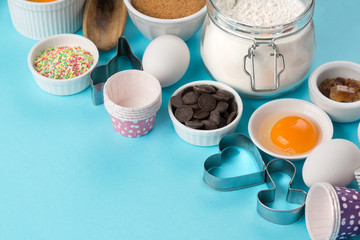 Ingredients and utensils for baking, blue background