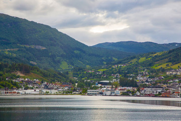 Small Norwegian town on shore of a fjord in Norway